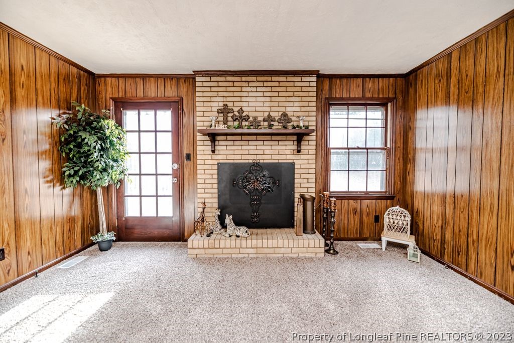 634 Richmond Road Rockingham, NC 28379 - Photo 4 of 40 a living room with furniture and a fireplace