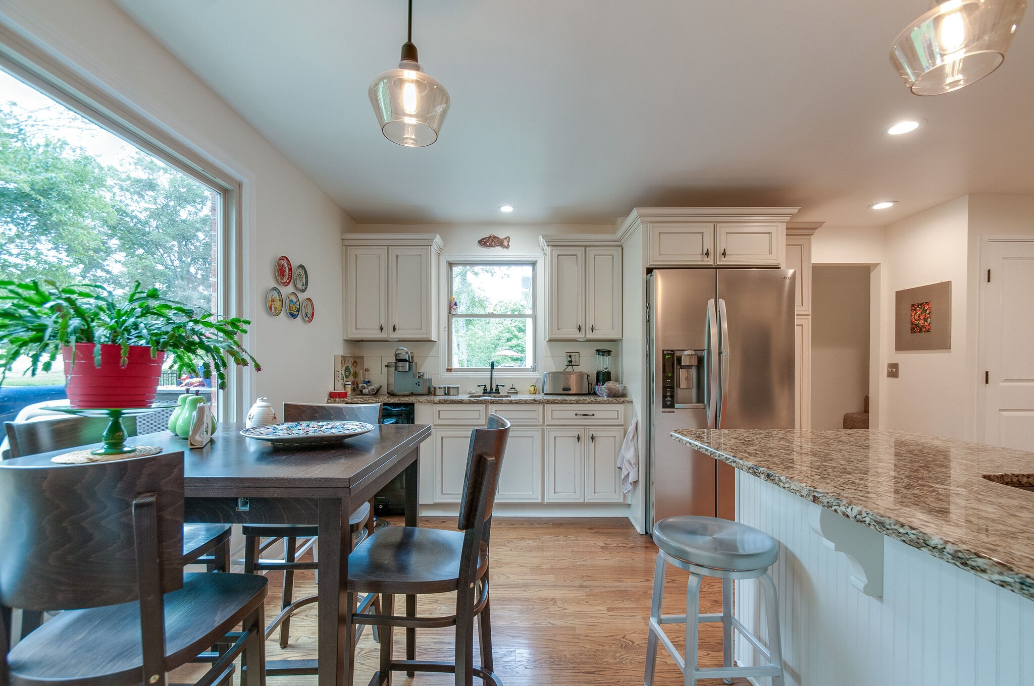 147 Baltusrol Road Franklin, TN 37069 - Photo 22 of 41 a kitchen with granite countertop kitchen island dining table and stainless steel appliances