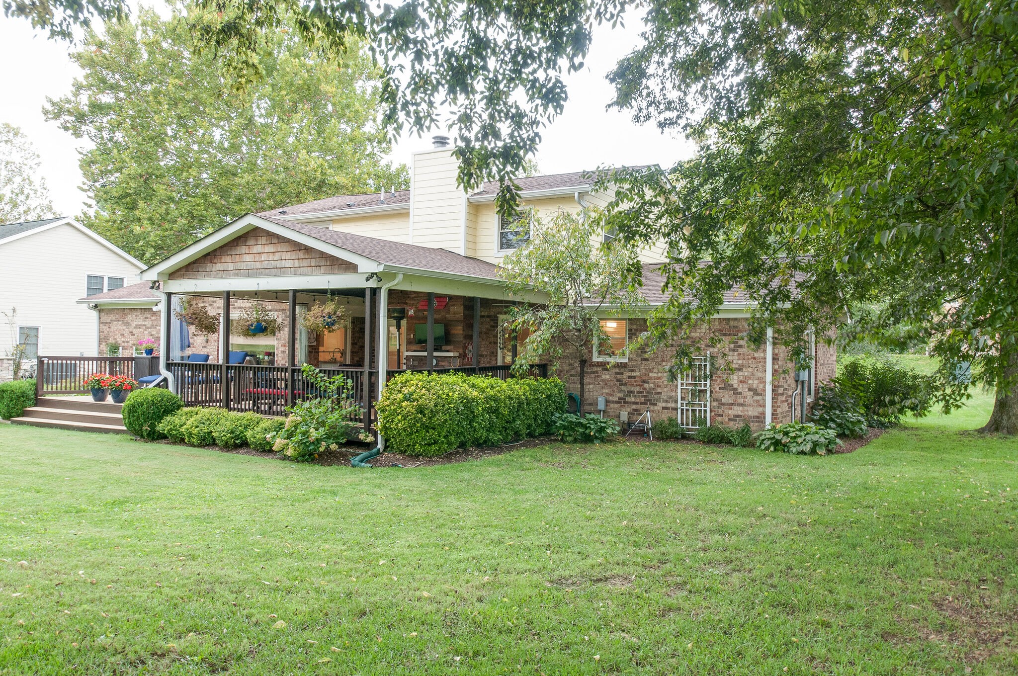147 Baltusrol Road Franklin, TN 37069 - Photo 41 of 41 a view of a house next to a big yard and large trees