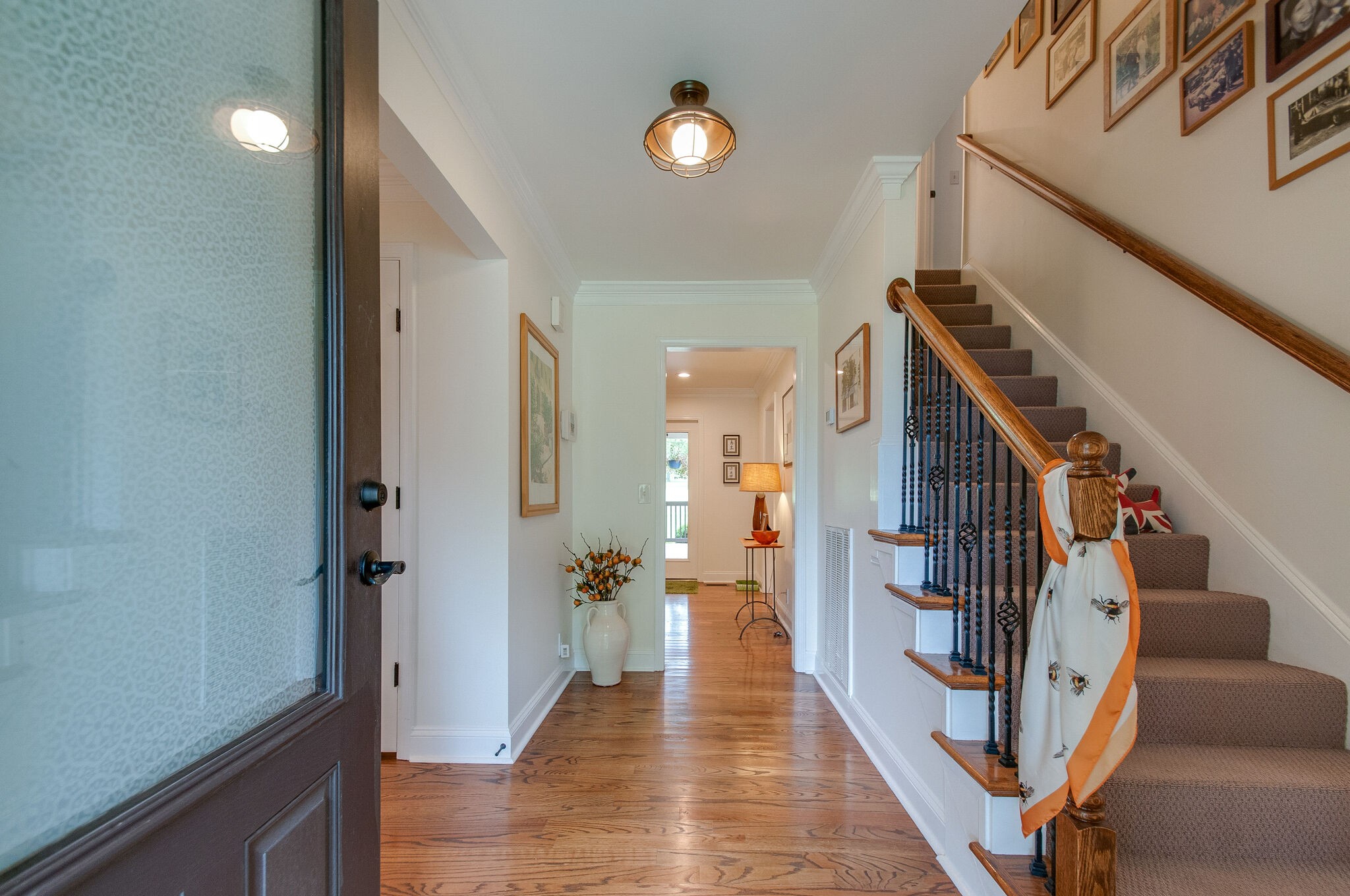 147 Baltusrol Road Franklin, TN 37069 - Photo 7 of 41 a view of a hallway with wooden floor and staircase