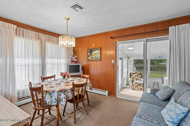 a view of a livingroom with furniture and window