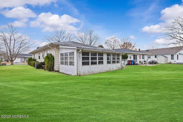 a view of a house with a big yard