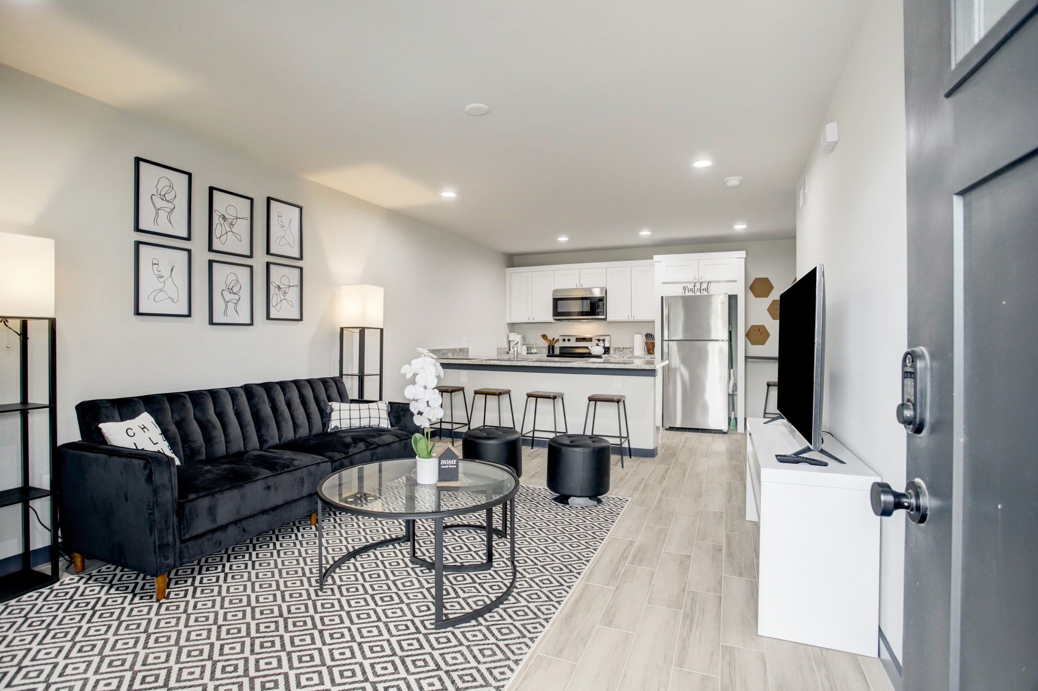 a living room with furniture and a flat screen tv