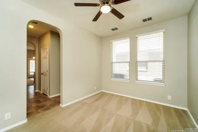 a view of an empty room with a window