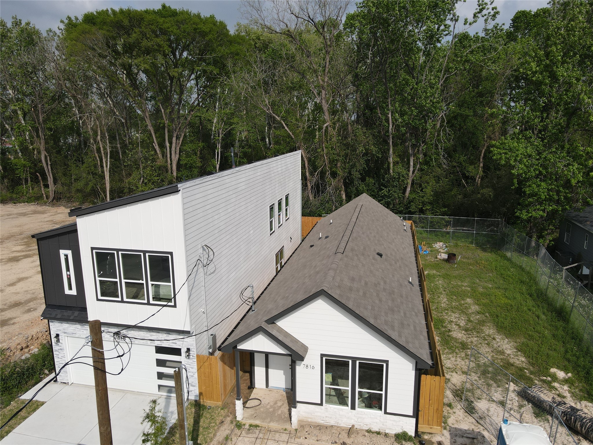 7800 Sand Street Houston, TX 77088 - Photo 4 of 4 a aerial view of a house with a yard and balcony