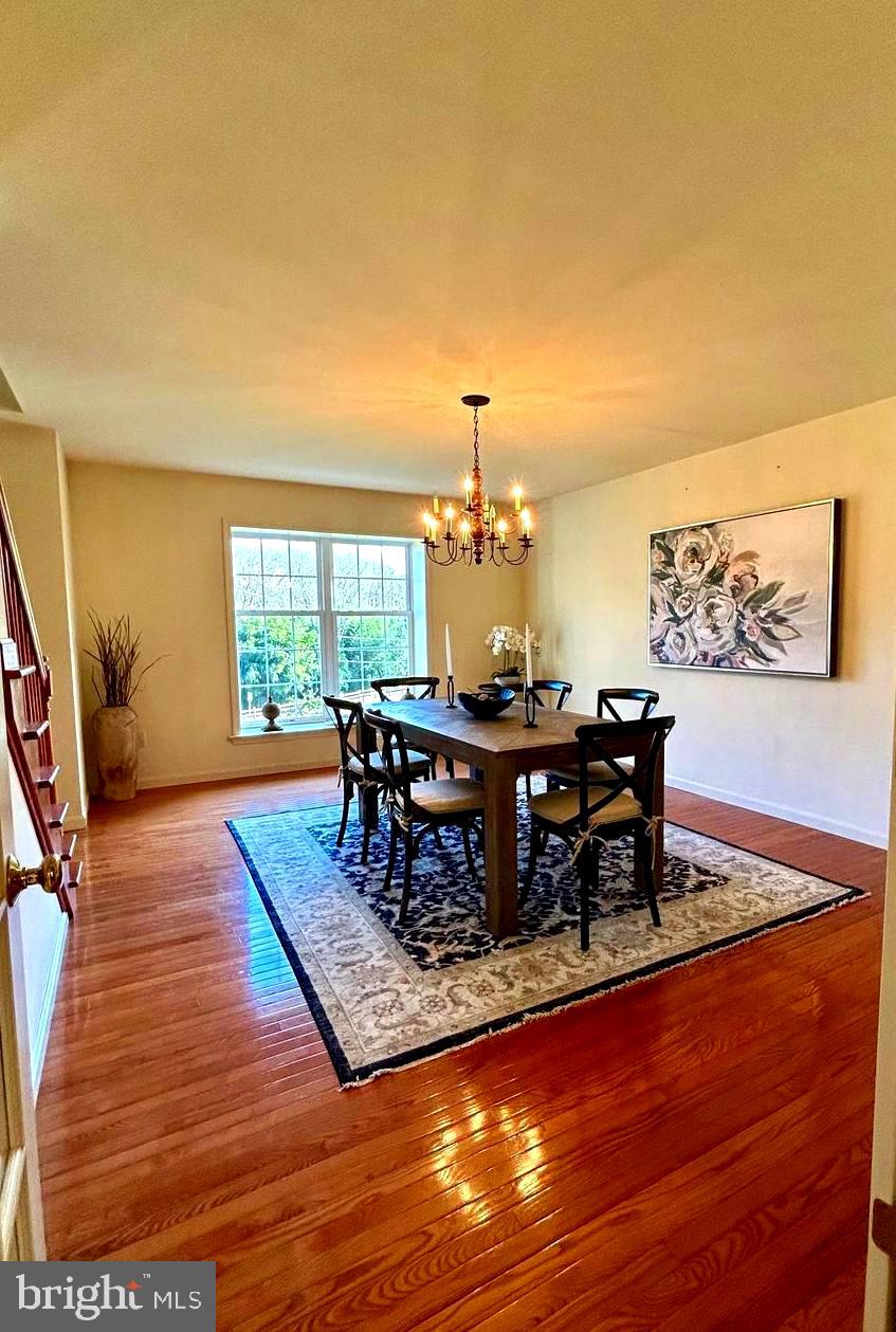 214 Pumping Station Road Quarryville, PA 17566 - Photo 12 of 46 a living room with dining room and wooden floor