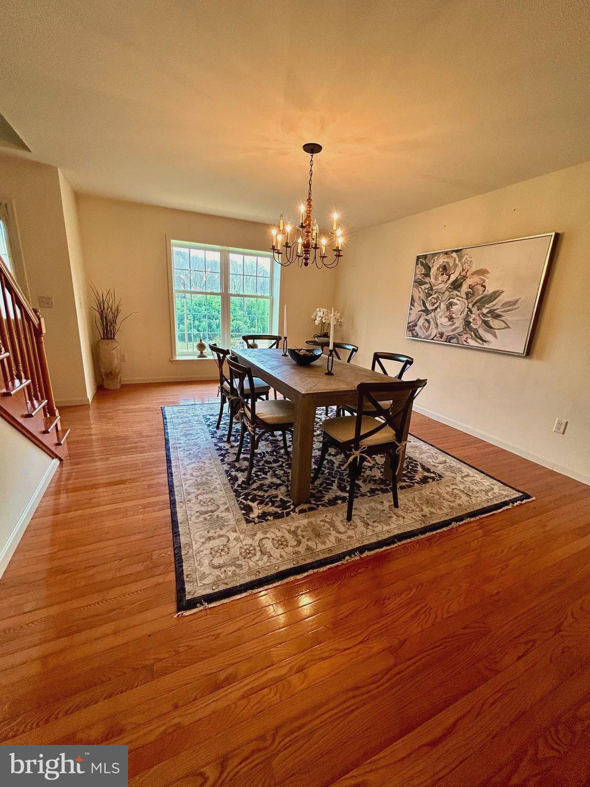 214 Pumping Station Road Quarryville, PA 17566 - Photo 13 of 46 a dining room with furniture a rug and wooden floor