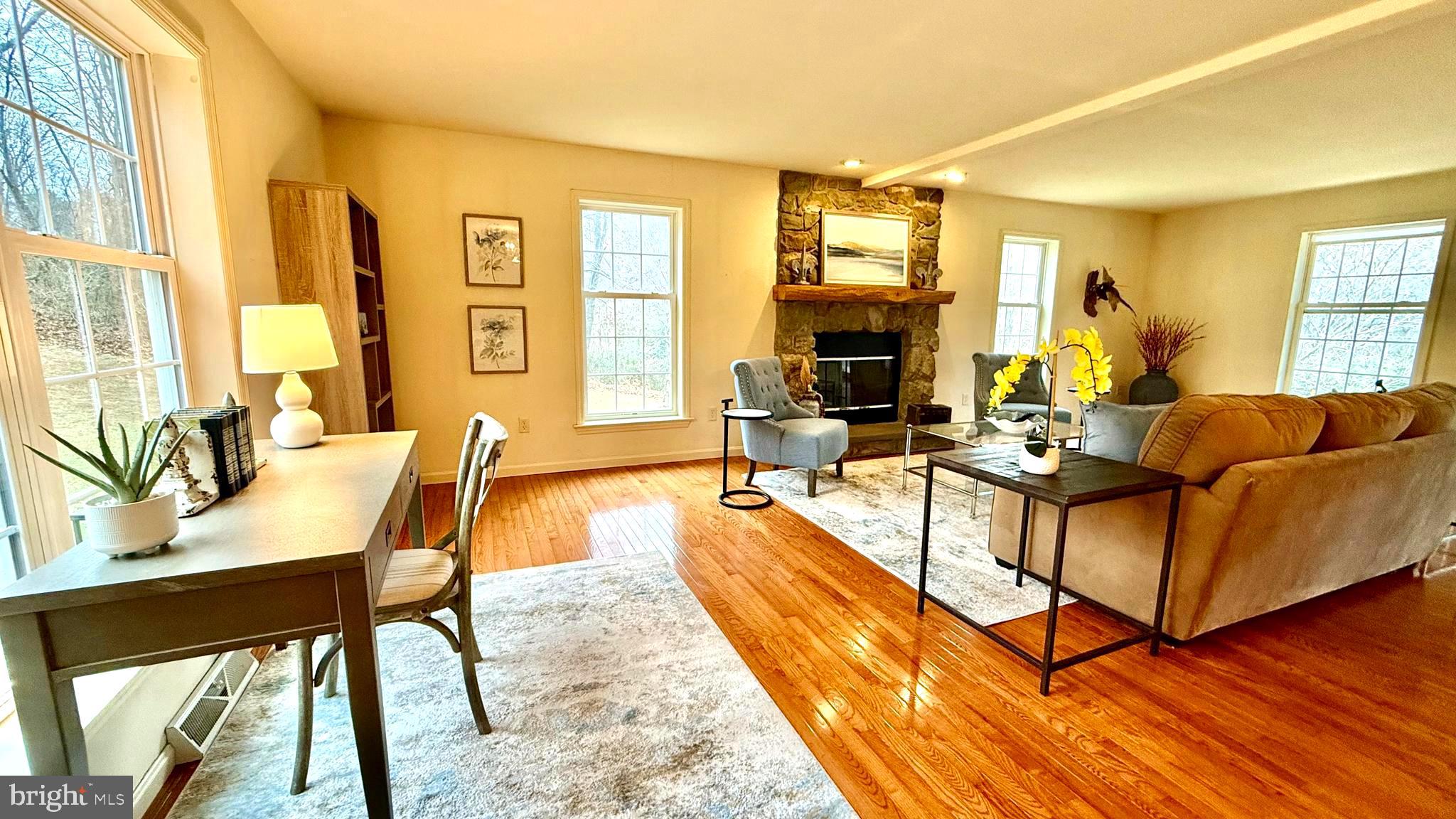 214 Pumping Station Road Quarryville, PA 17566 - Photo 17 of 46 a living room with fireplace furniture and a wooden floor