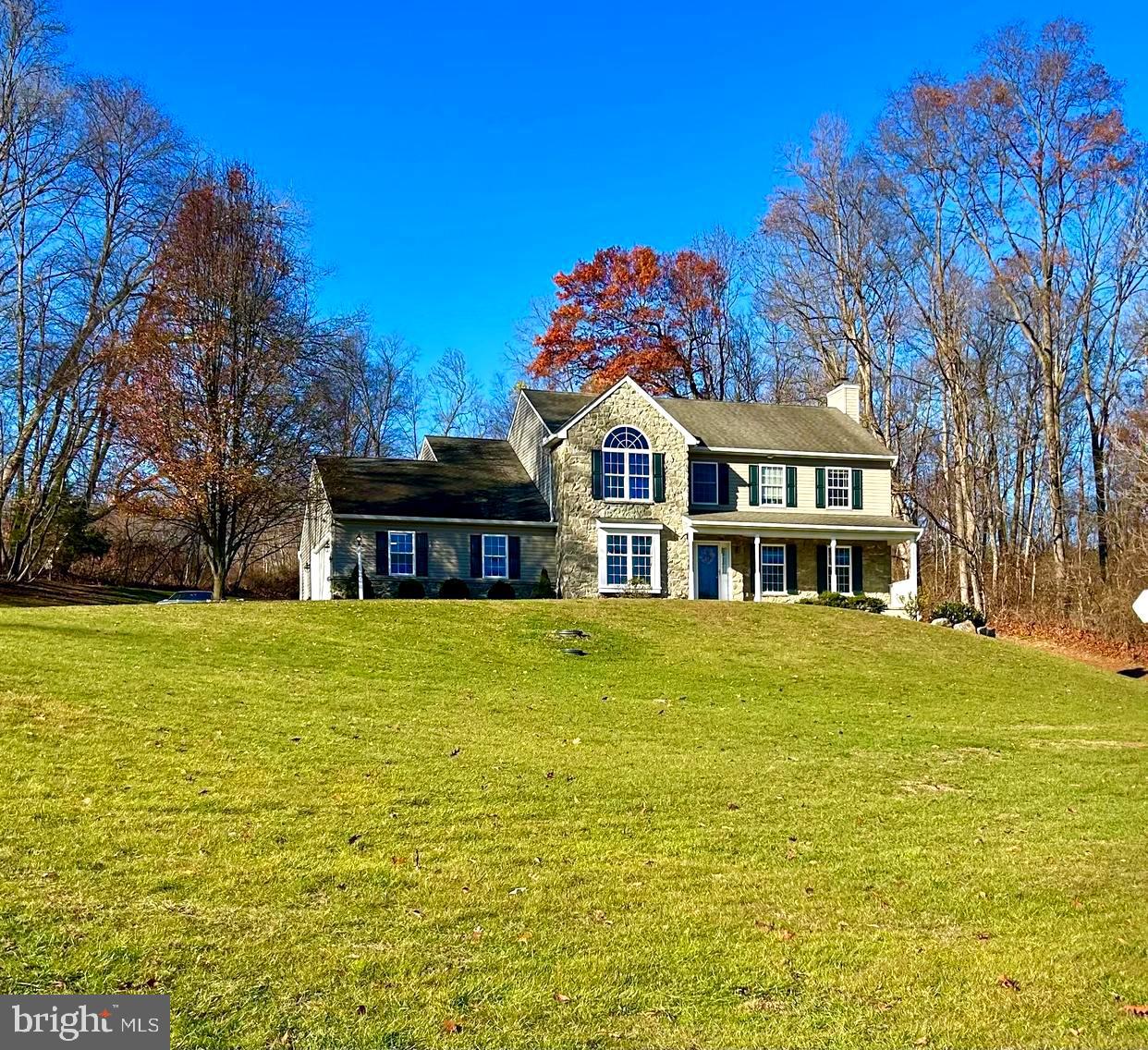 214 Pumping Station Road Quarryville, PA 17566 - Photo 2 of 46 a front view of a house with a garden