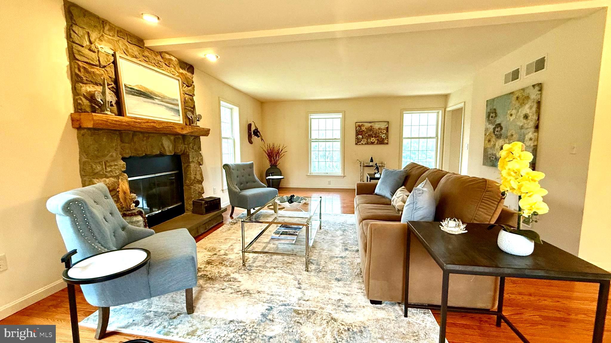 214 Pumping Station Road Quarryville, PA 17566 - Photo 23 of 46 a living room with furniture fireplace and a flat screen tv