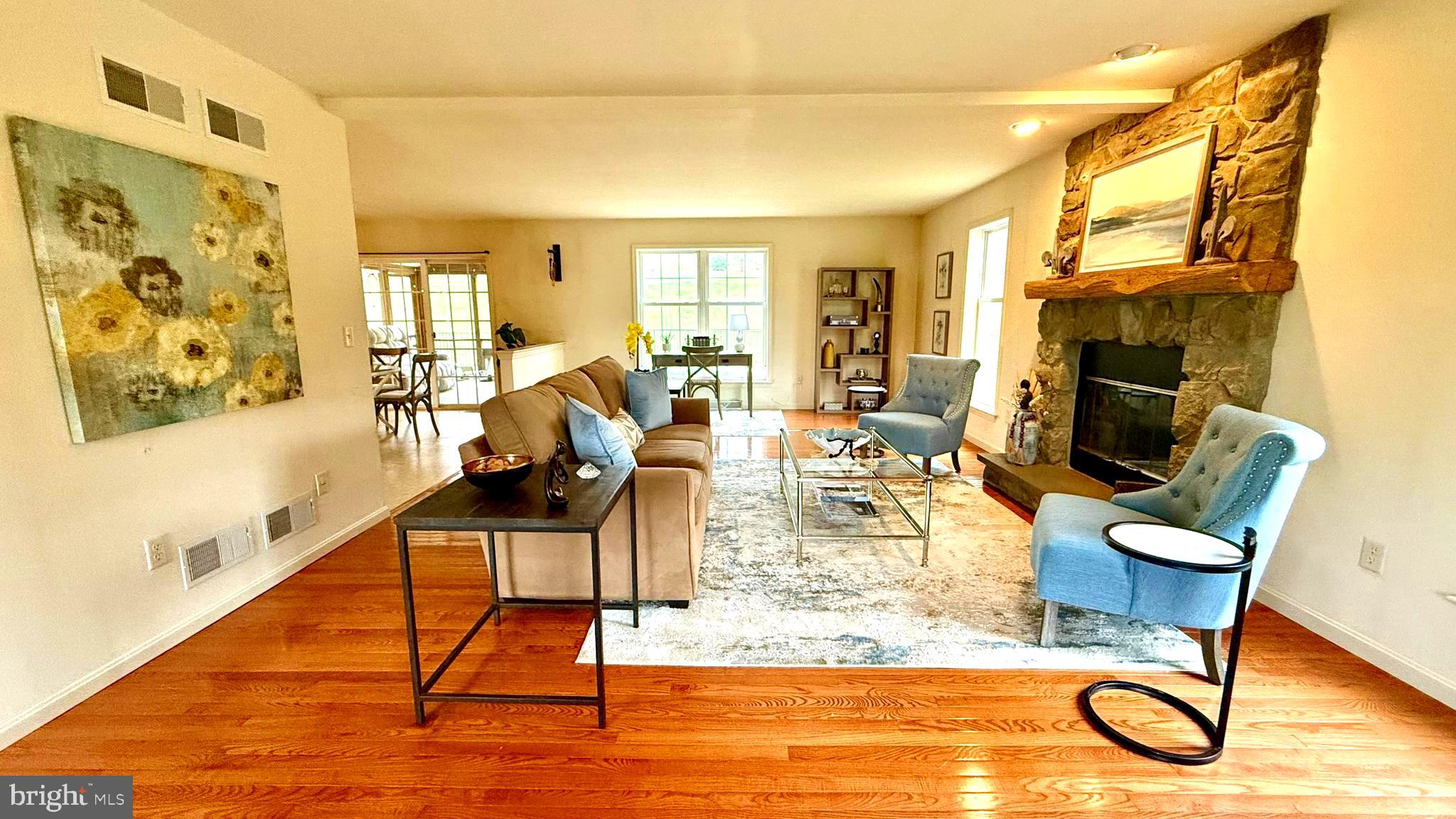 214 Pumping Station Road Quarryville, PA 17566 - Photo 24 of 46 a living room with furniture a rug and a floor to ceiling window