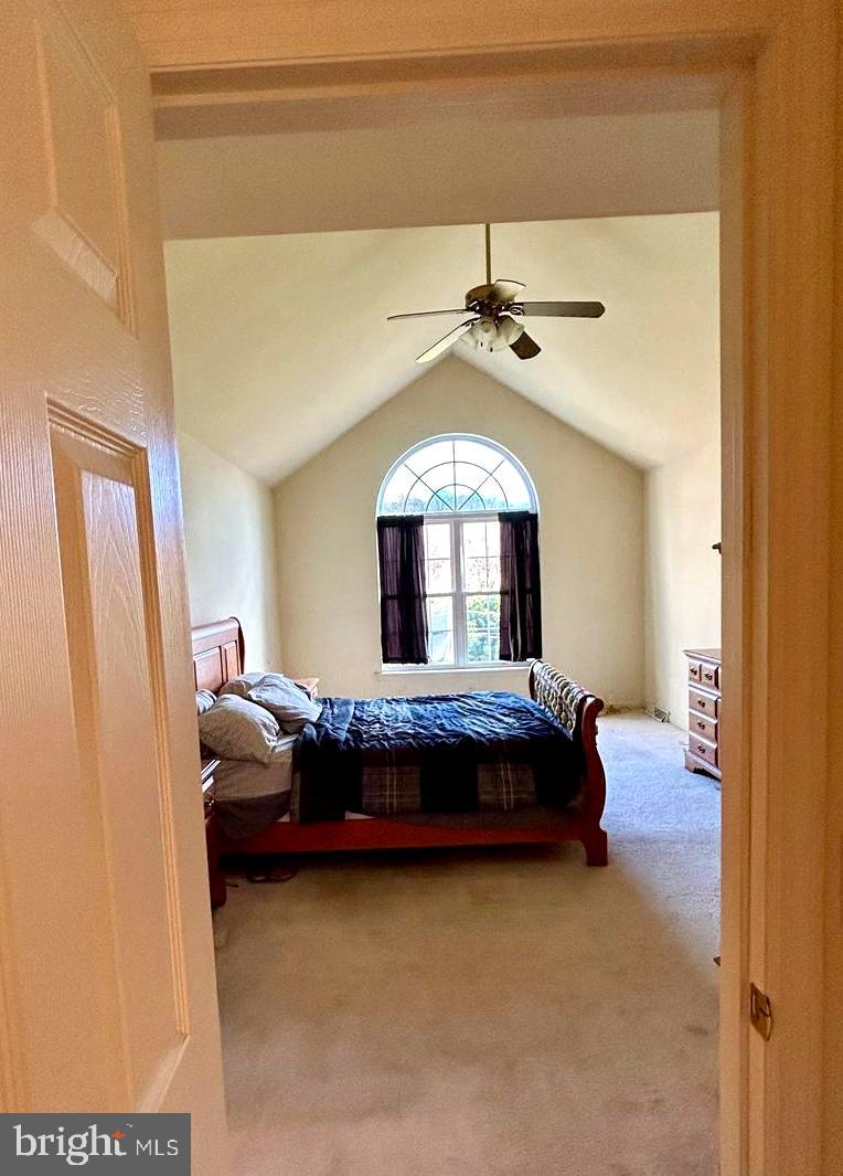 214 Pumping Station Road Quarryville, PA 17566 - Photo 29 of 46 a bedroom with a bed and a chandelier