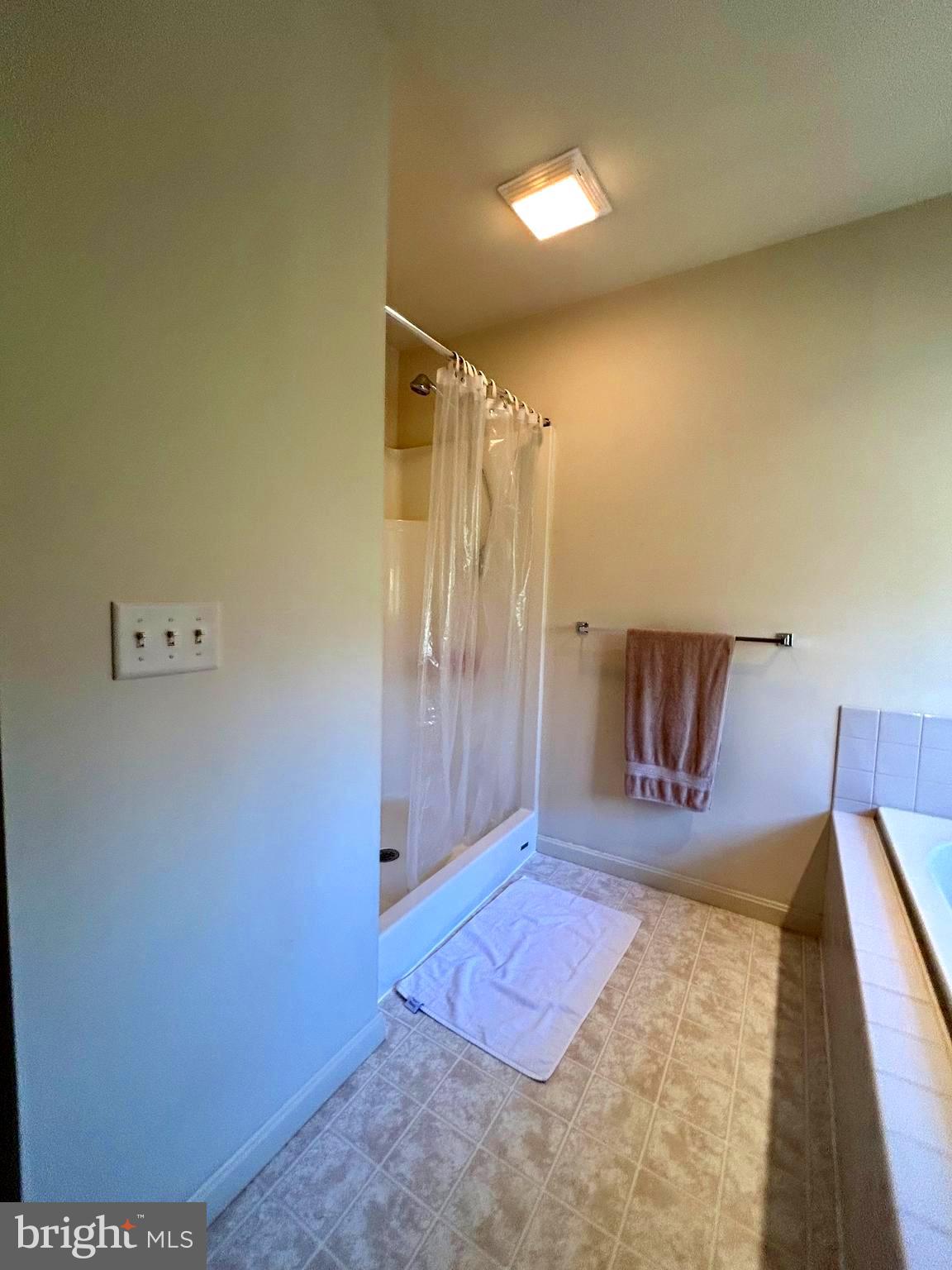 214 Pumping Station Road Quarryville, PA 17566 - Photo 30 of 46 a spacious bedroom with a bed and wooden floor