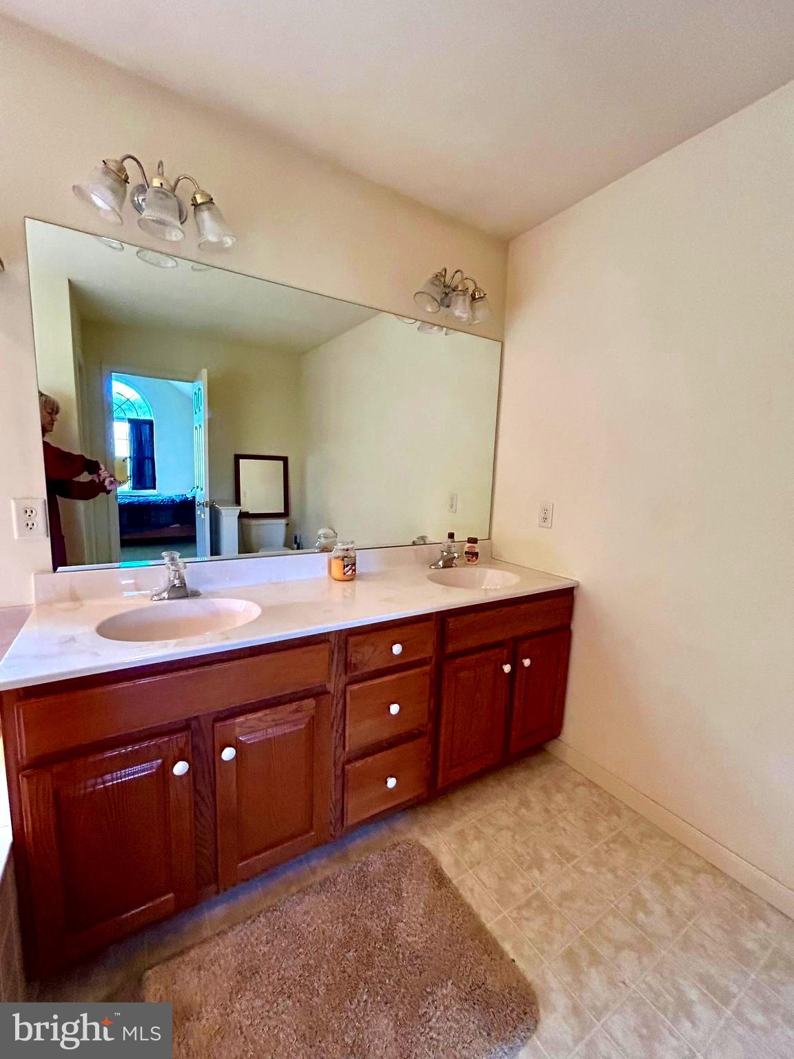 214 Pumping Station Road Quarryville, PA 17566 - Photo 32 of 46 a spacious bathroom with a double vanity sink and a mirror