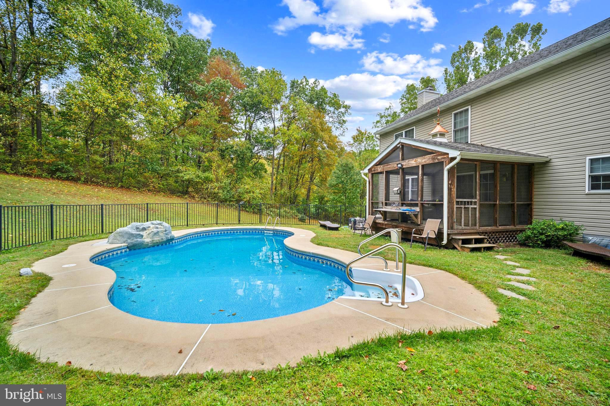 214 Pumping Station Road Quarryville, PA 17566 - Photo 40 of 46 a view of a house with swimming pool and sitting area