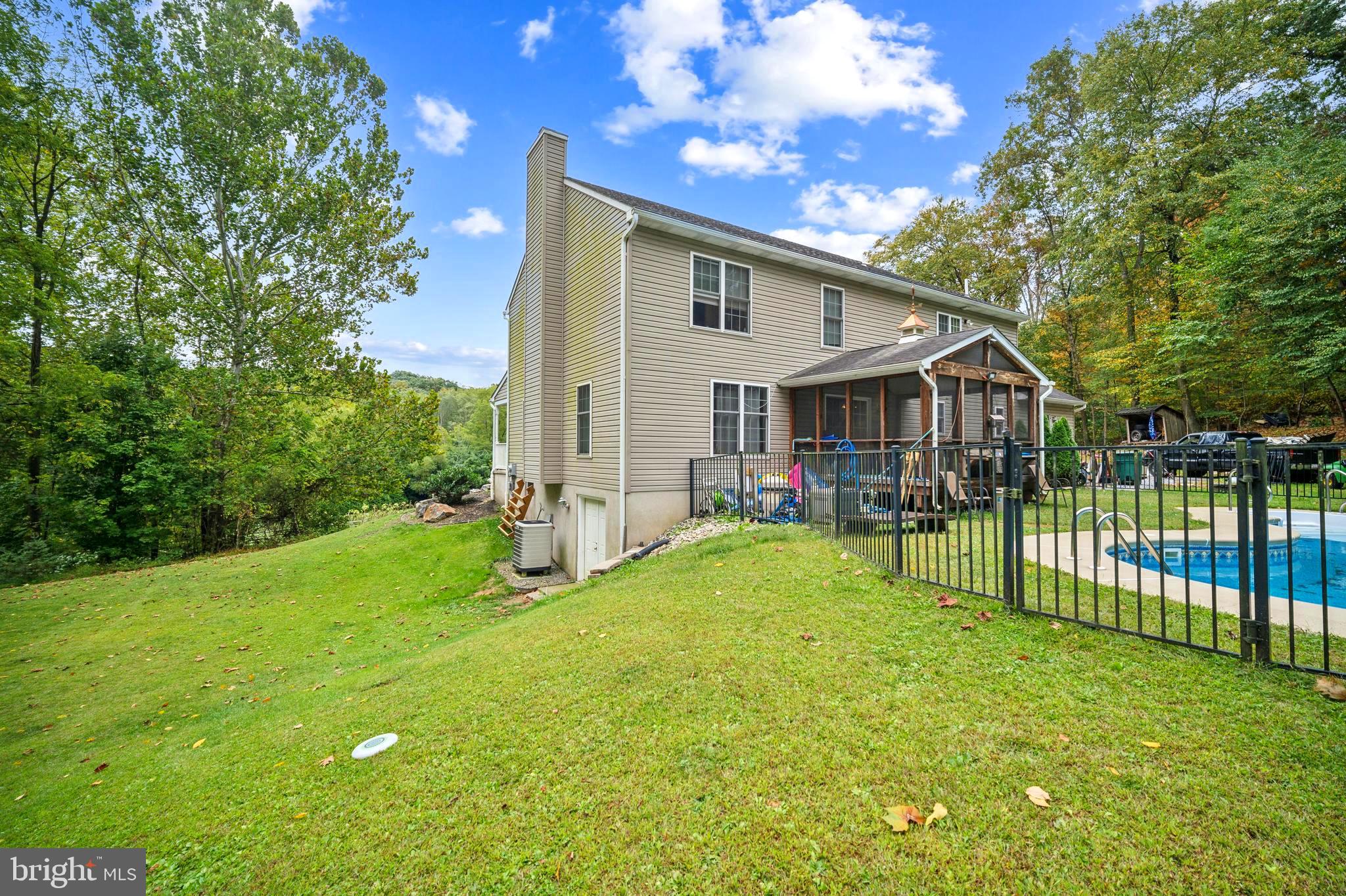 214 Pumping Station Road Quarryville, PA 17566 - Photo 43 of 46 a view of backyard of house with wooden deck and seating