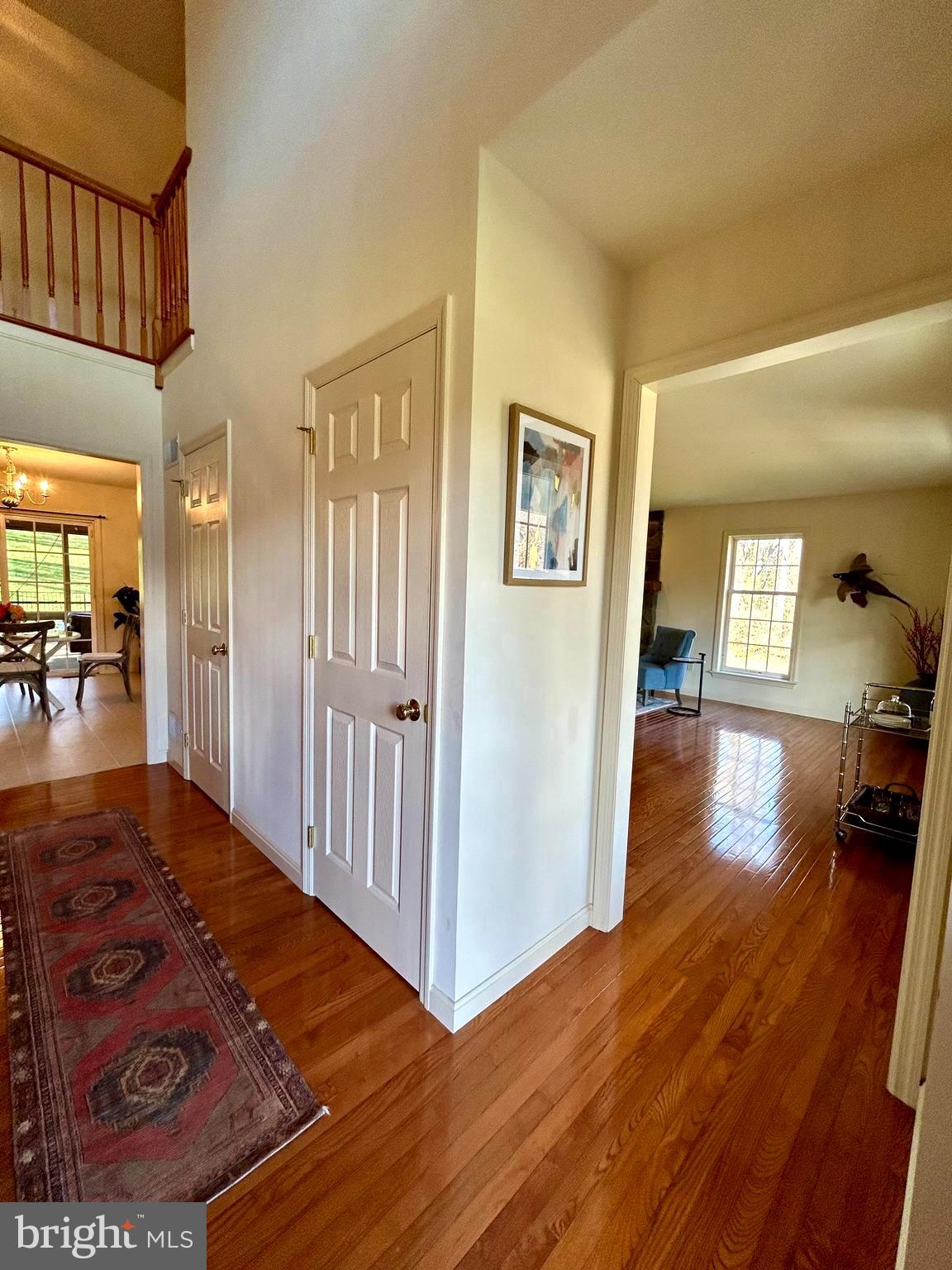 214 Pumping Station Road Quarryville, PA 17566 - Photo 5 of 46 a view of a hallway view with wooden floor and dining room