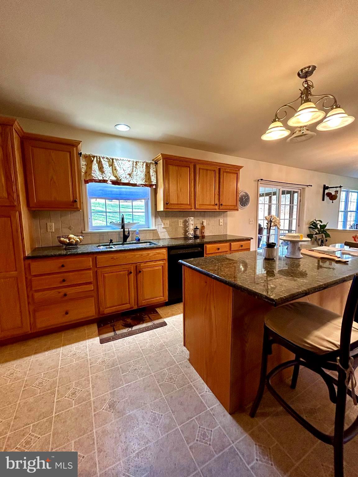 214 Pumping Station Road Quarryville, PA 17566 - Photo 7 of 46 a kitchen with granite countertop a sink and cabinets