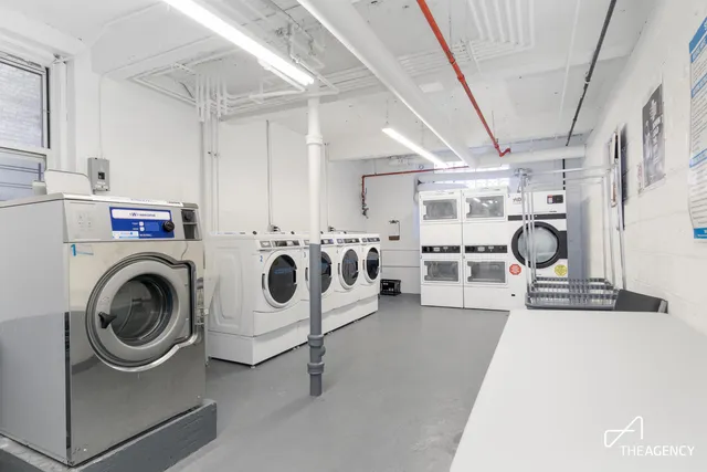 a room with gym equipment and a mirror