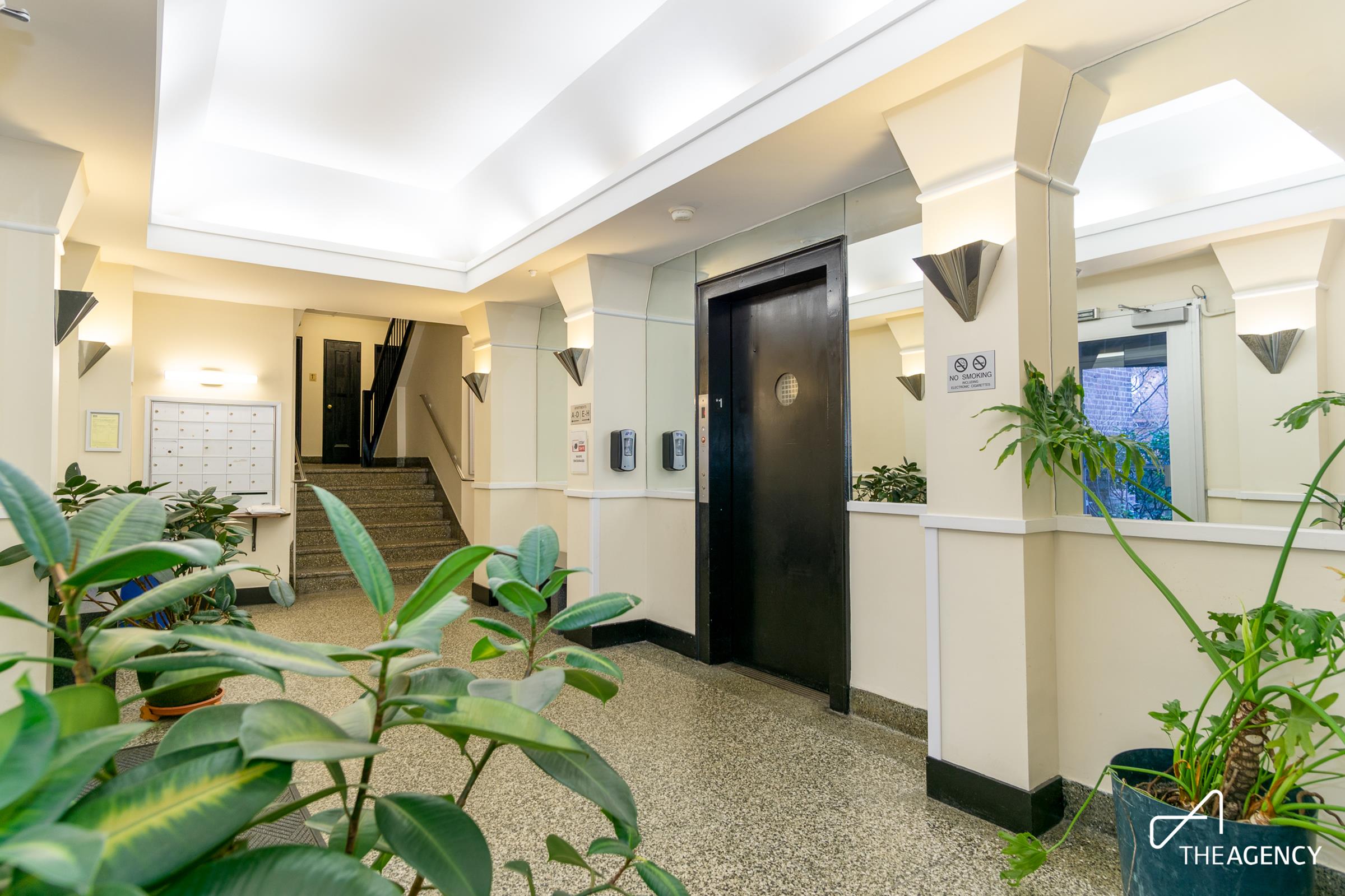 153 Bennett Avenue, Unit 3G Manhattan, NY 10040 - Photo 12 of 14 a hallway with painting and a potted plant
