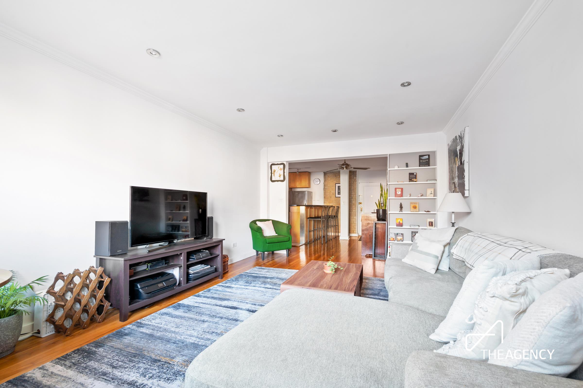 153 Bennett Avenue, Unit 3G Manhattan, NY 10040 - Photo 3 of 14 a living room with furniture and a flat screen tv