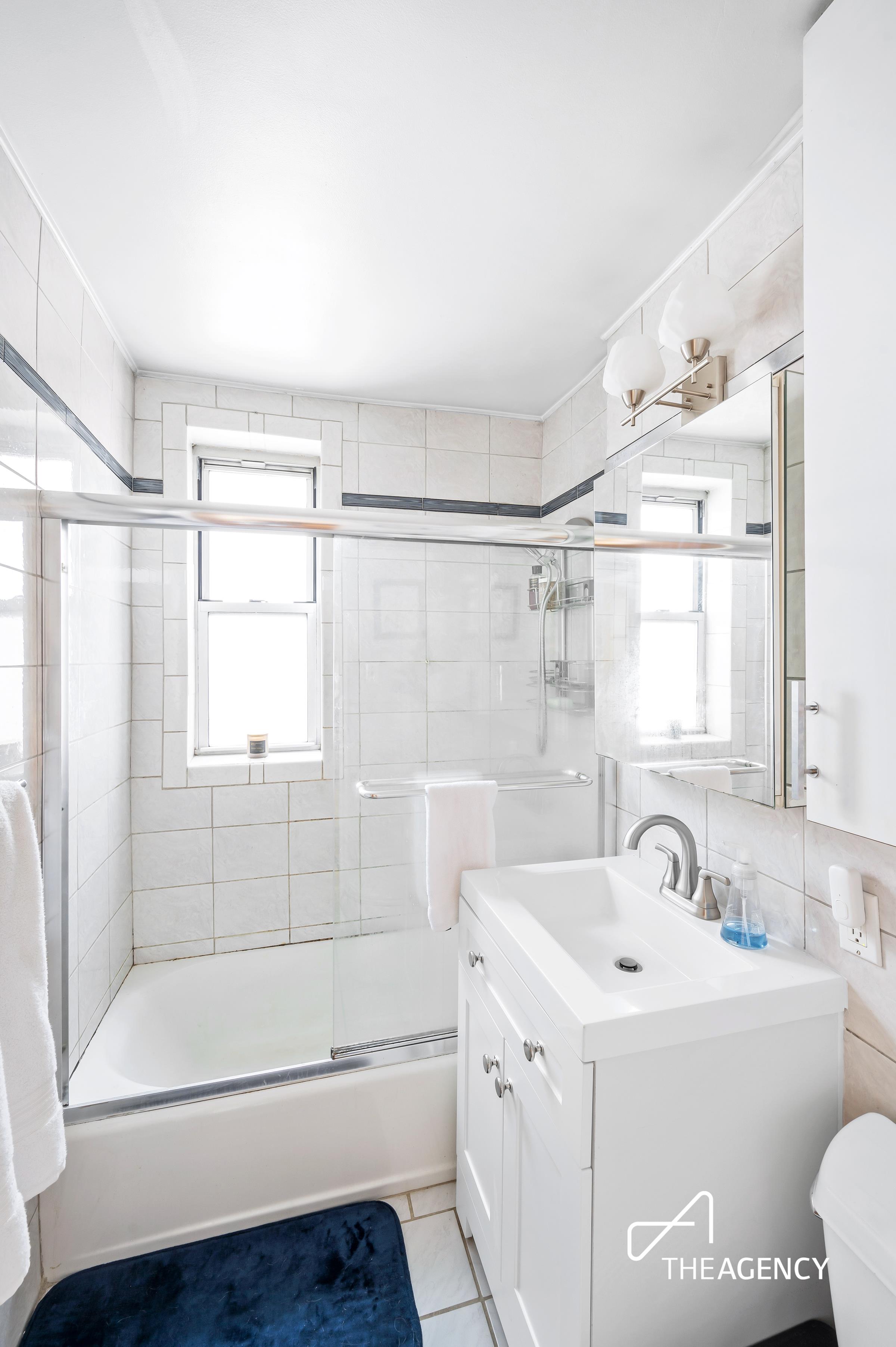 153 Bennett Avenue, Unit 3G Manhattan, NY 10040 - Photo 6 of 14 a bathroom with a bathtub and a sink