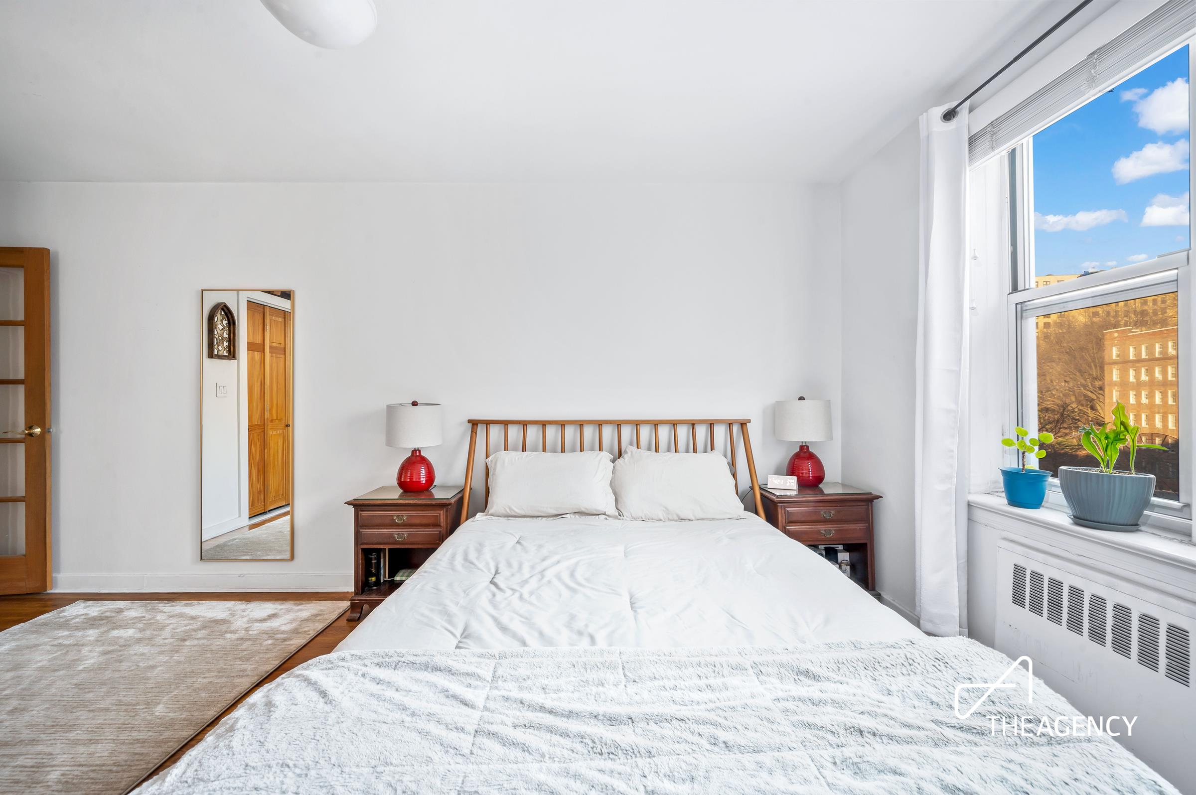 153 Bennett Avenue, Unit 3G Manhattan, NY 10040 - Photo 8 of 14 a bedroom with a bed and a large window