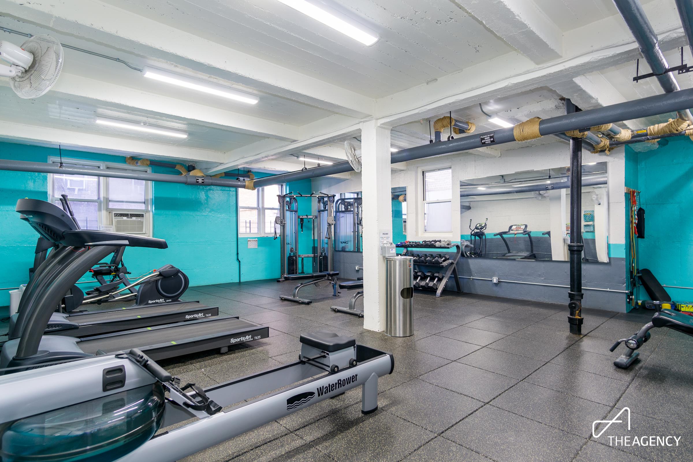 153 Bennett Avenue, Unit 3G Manhattan, NY 10040 - Photo 9 of 14 a room with gym equipment and a mirror