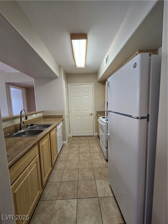 8000 West Badura Avenue, Unit 2135 Las Vegas, NV 89113 - Photo 11 of 28 Kitchen featuring fridge, light tile patterned flooring, stove, dark stone counters, and dishwasher