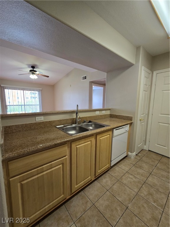 8000 West Badura Avenue, Unit 2135 Las Vegas, NV 89113 - Photo 12 of 28 Kitchen featuring a textured ceiling, dishwashing machine, a ceiling fan, light tile patterned floors, and light brown cabinetry