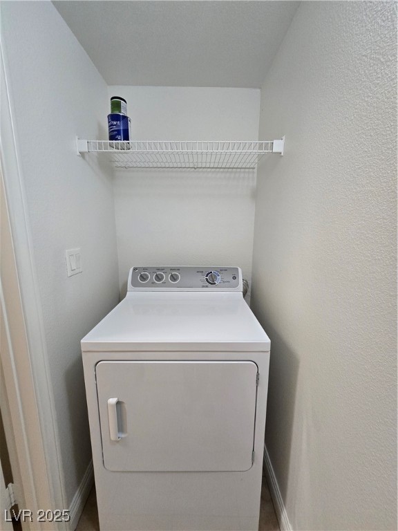 8000 West Badura Avenue, Unit 2135 Las Vegas, NV 89113 - Photo 24 of 28 Laundry area with washer / dryer and a textured wall