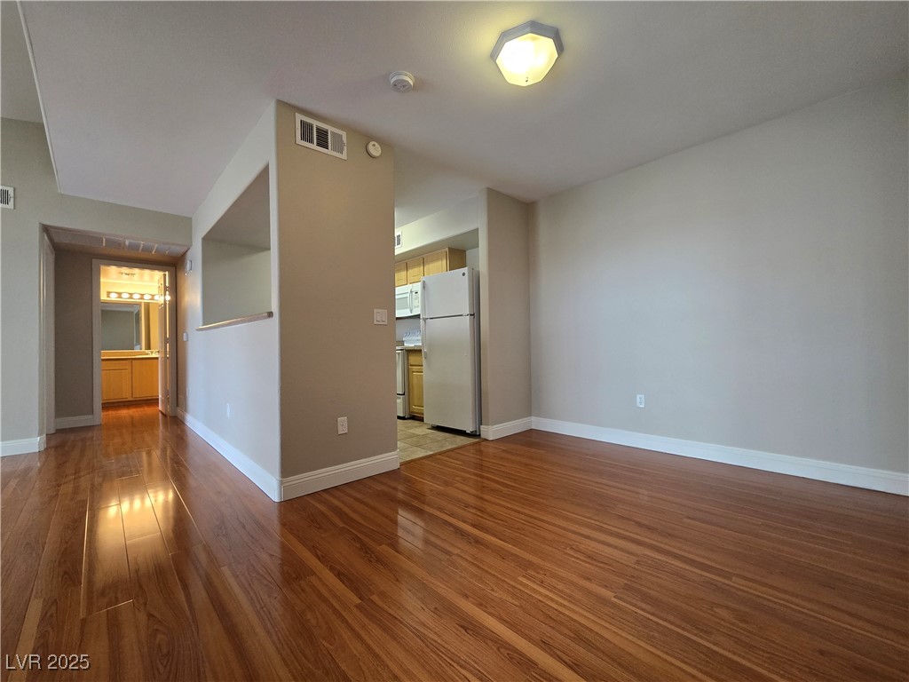 8000 West Badura Avenue, Unit 2135 Las Vegas, NV 89113 - Photo 10 of 28 Empty room with baseboards and light wood-style flooring