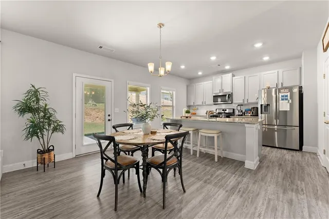 a bathroom with a sink toilet and a mirror