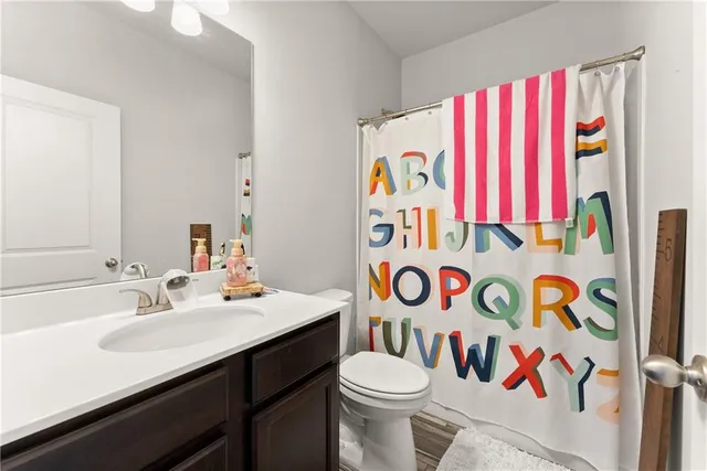 a spacious bedroom with a bed and a window