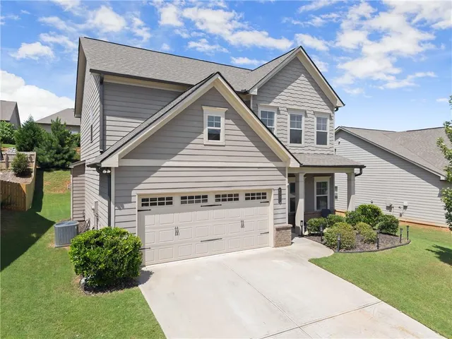 an aerial view of a house with a swimming pool