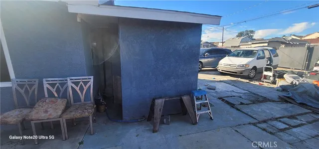 a view of a car park in front of house
