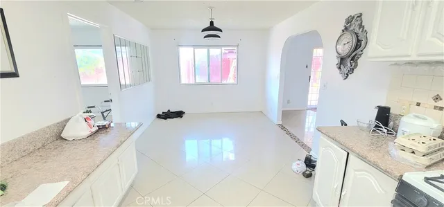 a view of entryway with furniture and wooden floor