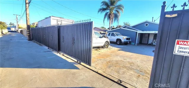 a view of a terrace with a wooden fence