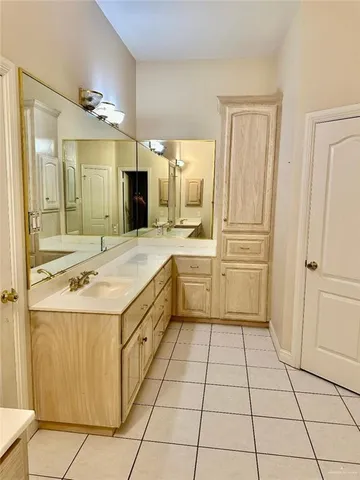 a kitchen with a stove a sink and a refrigerator