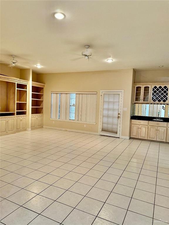 3206 West San Luis Circle Mission, TX 78573 - Photo 2 of 14 an empty room with windows and cabinet