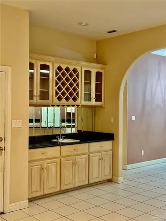 a kitchen with a sink and cabinets