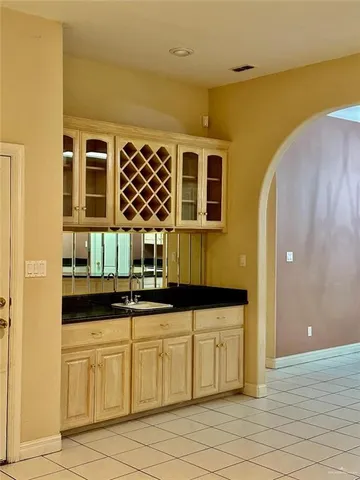 a kitchen with a sink and cabinets