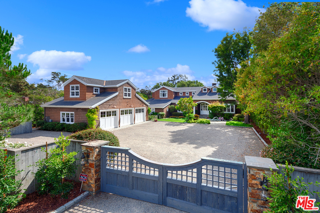 6763 Zumirez Drive Malibu, CA 90265 - Photo 11 of 52 a front view of a house with garden