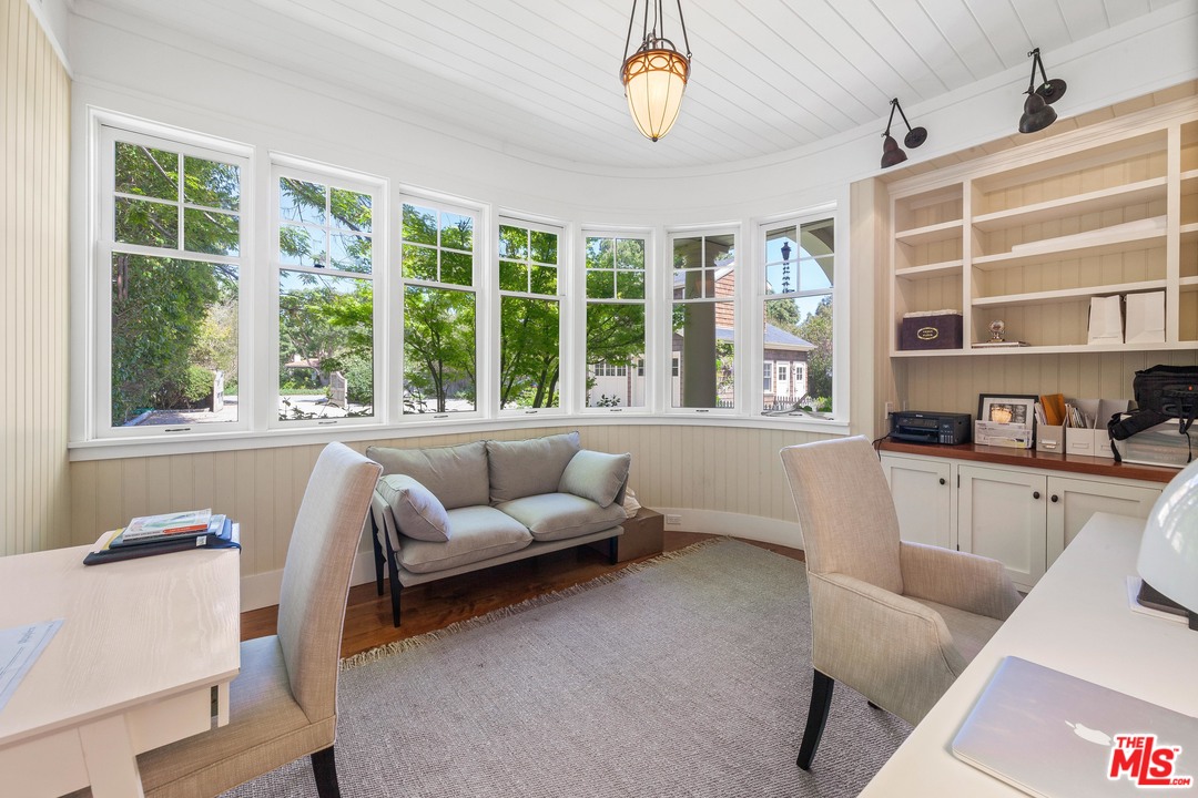 6763 Zumirez Drive Malibu, CA 90265 - Photo 12 of 52 a living room with furniture and a large window