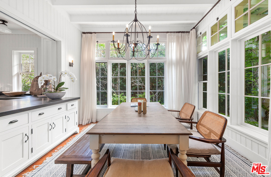 6763 Zumirez Drive Malibu, CA 90265 - Photo 19 of 52 a view of a dining room with furniture window and outside view