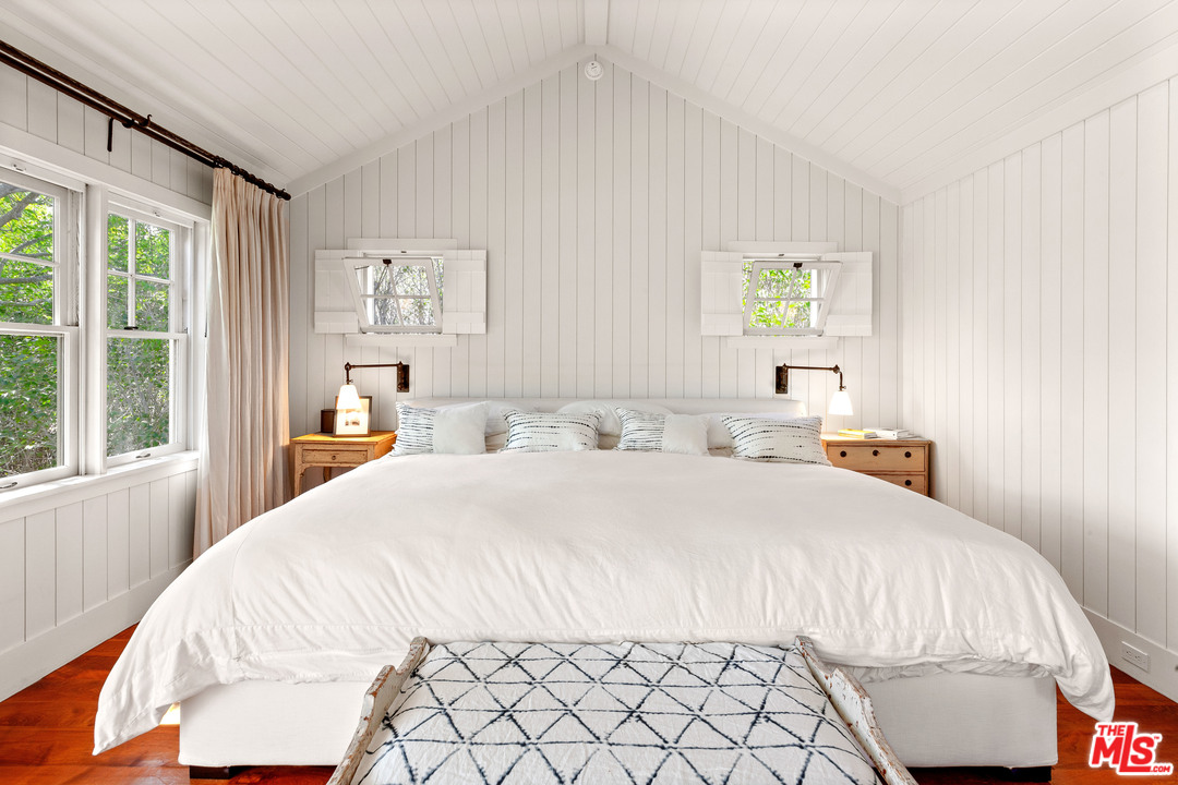 6763 Zumirez Drive Malibu, CA 90265 - Photo 29 of 52 a bedroom with a bed and a window