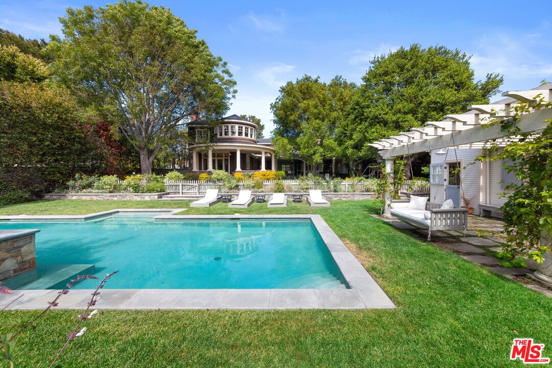 6763 Zumirez Drive Malibu, CA 90265 - Photo 36 of 52 a view of a house with a swimming pool