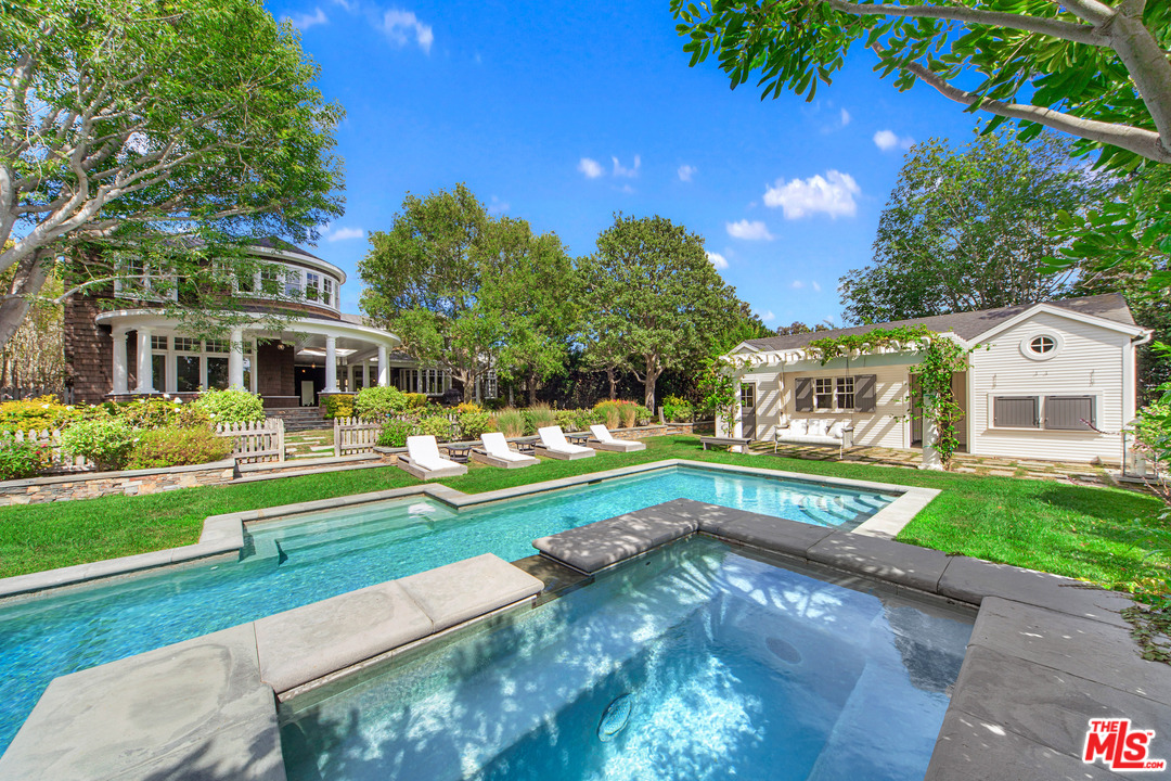 6763 Zumirez Drive Malibu, CA 90265 - Photo 38 of 52 a front view of a house with a yard