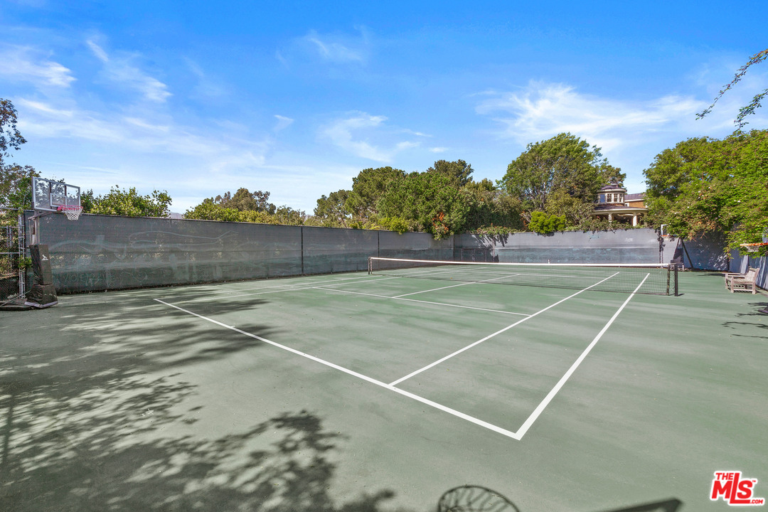 6763 Zumirez Drive Malibu, CA 90265 - Photo 46 of 52 a view of an outdoor space and tennis court