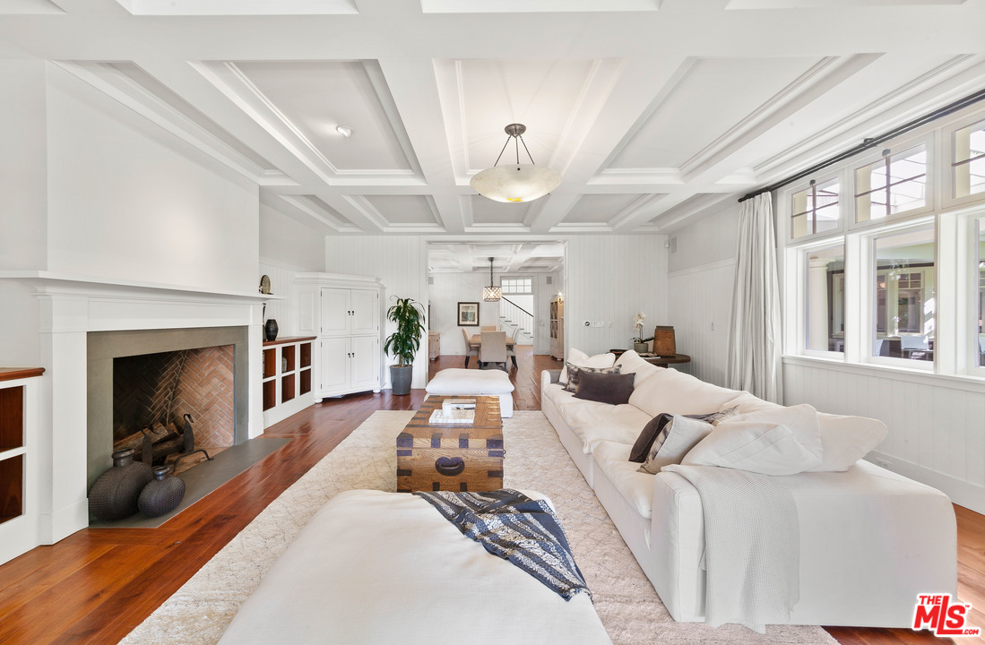 6763 Zumirez Drive Malibu, CA 90265 - Photo 8 of 52 a bed room with furniture and a fireplace